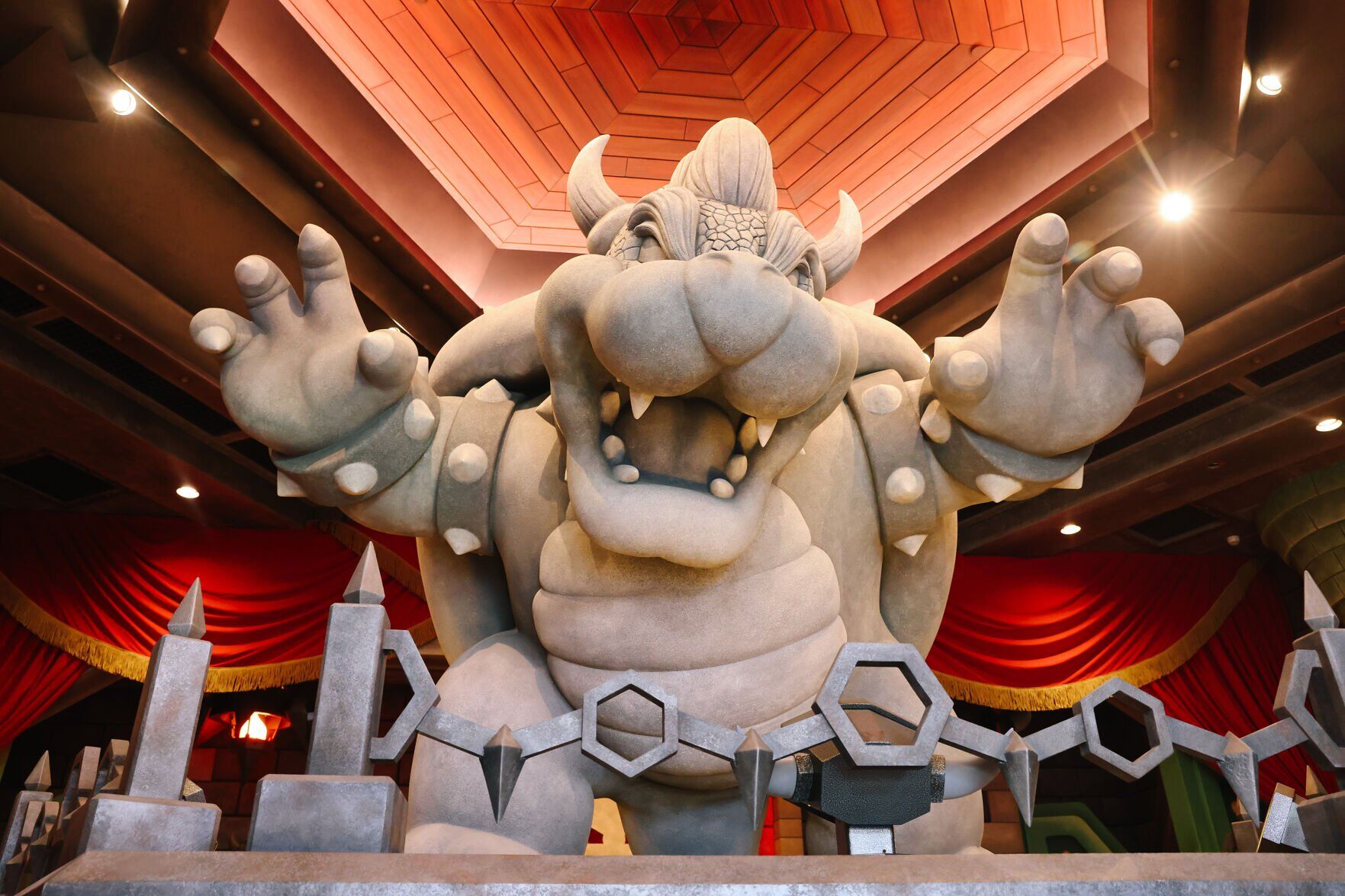 A large Bowser is seen inside a recreation of his castle at the first-ever theme park land themed to a video game franchise at Universal Studios Hollywood's Super Nintendo World on Dec. 19, 2022, in Los Angeles.
